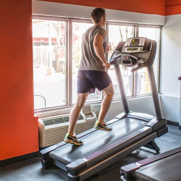 Top 15 Best Treadmills For Small Spaces You Should Not Skip 5 exhausted mid adult man running uphill on gym royalty free image 1600711038