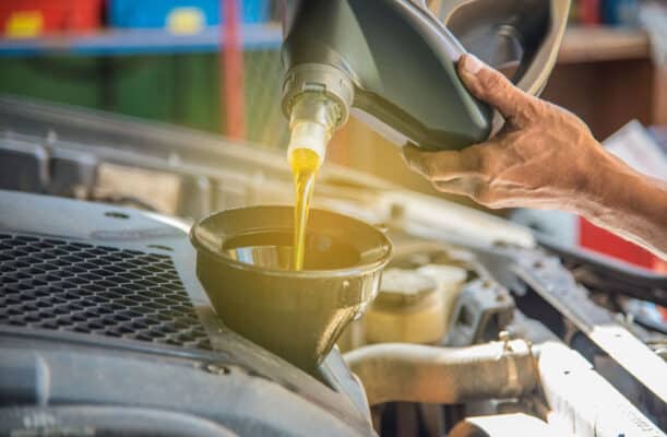 Home - Findingneverlandthemusical 3 man pouring oil into car royalty free image 1598901693